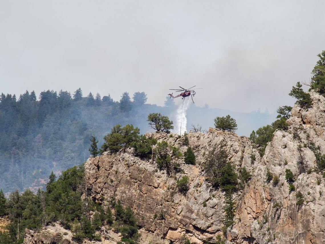 Helicopter releases water over Grizzly Creek Fire