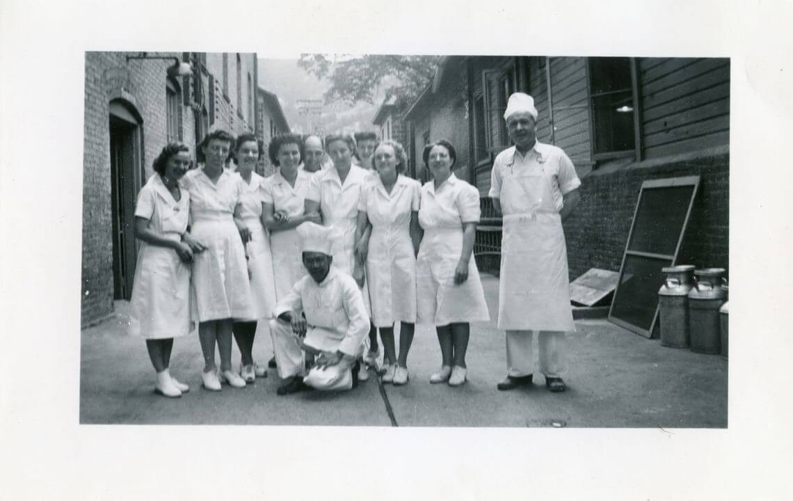Nurses and a cook pose outside Hotel Colorado in the 1930's
