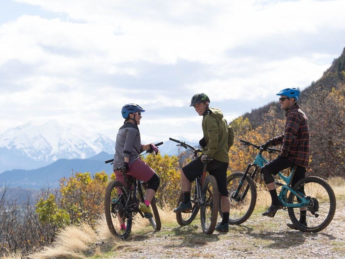 Three mountain bikers chatting on a trail near Glenwood Springs