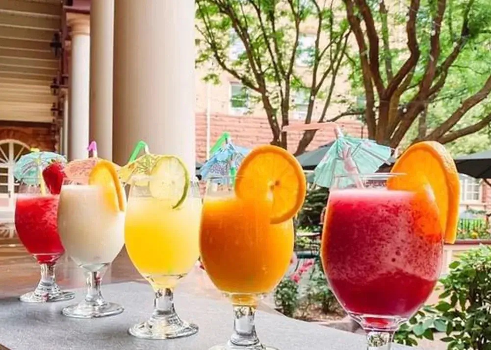 Five cocktails lined up on counter at Hotel Colorado