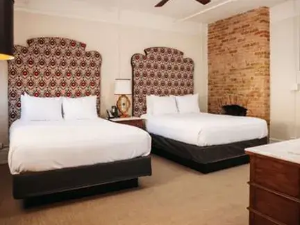 Double Queen Junior Suite bedroom at Hotel Colorado