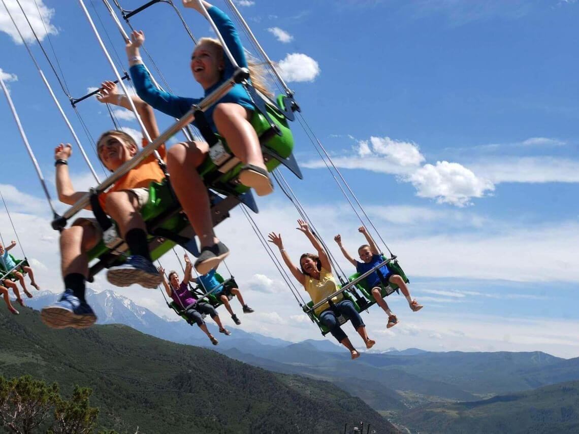 People enjoying a thrilling, kid-friendly ride on Glenwood Canyon Flyer at Glenwood Caverns Adventure Park