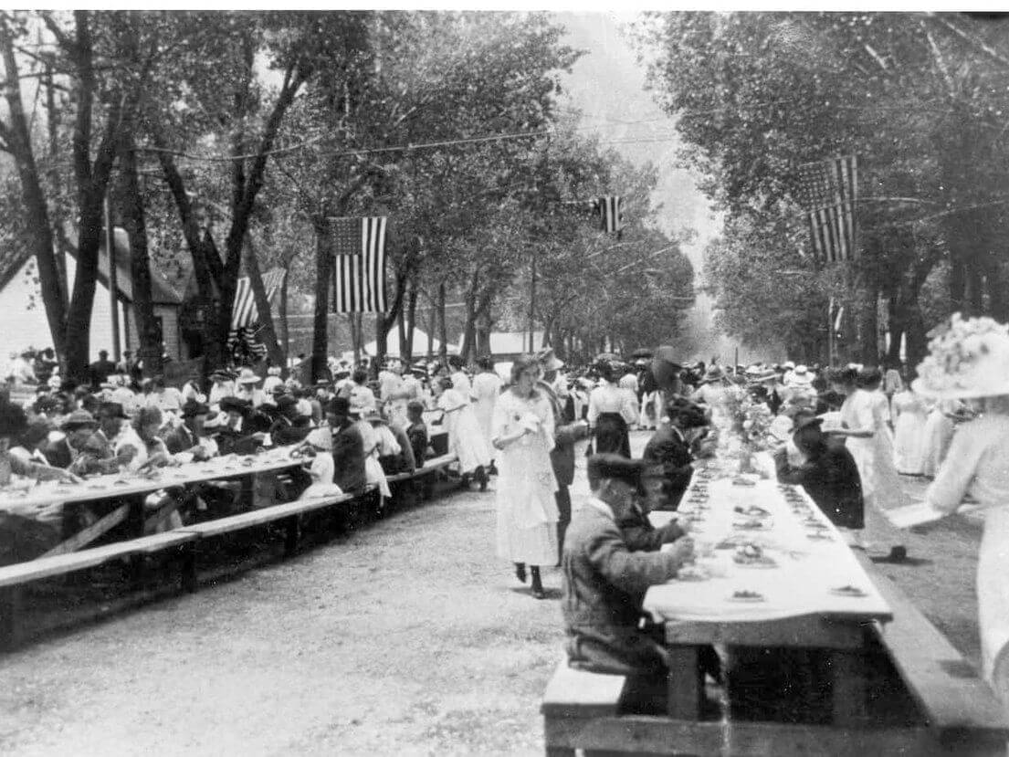 A vintage photograph of a large outdoor gathering during Strawberry Days in Glenwood Springs, Colorado