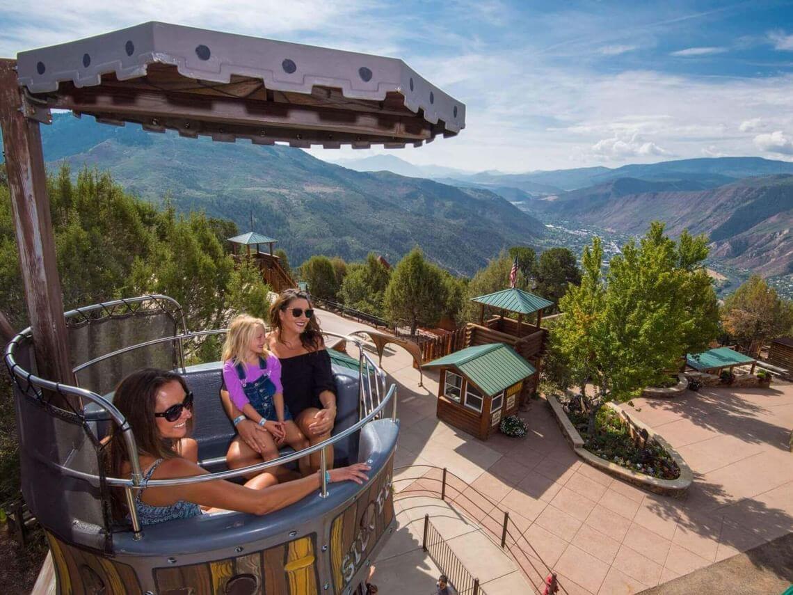 Three people enjoying the Mine wheel ride at Glenwood Caverns Adventure Park