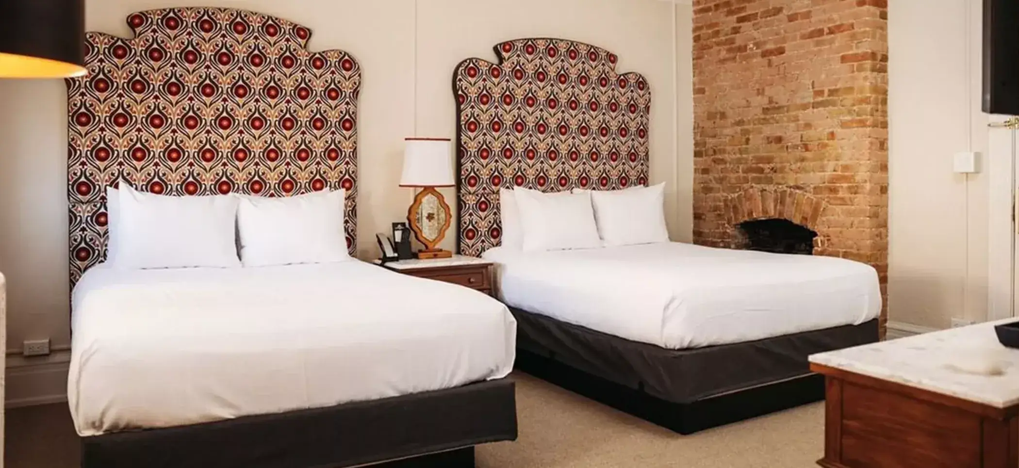 A Classic Suite at Hotel Colorado features two double beds and distinctive patterned headboards