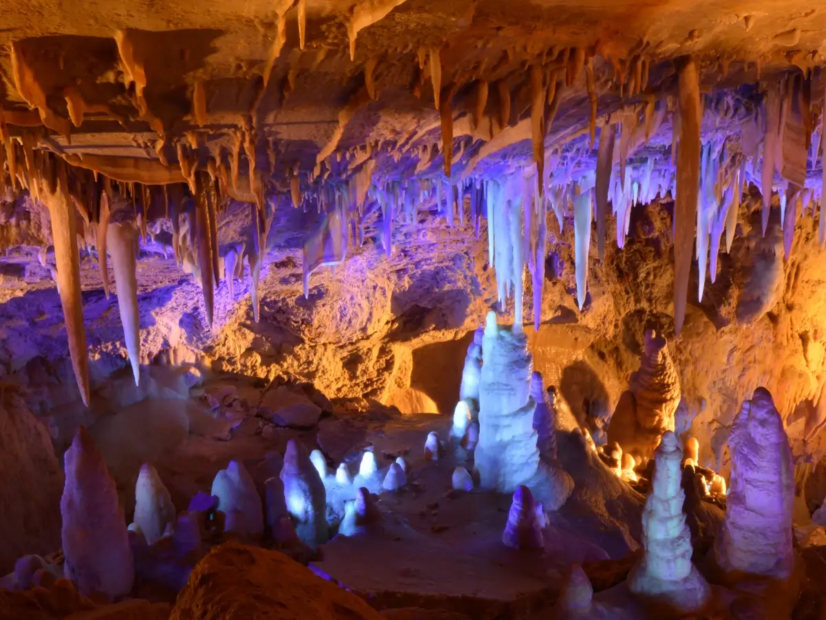 Lighted cave illuminates numerous stalactites and stalagmites at Glenwood Caverns Adventure Park
