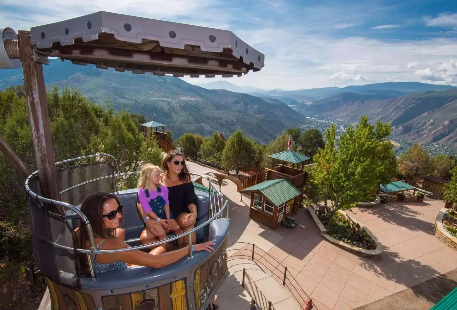 Three people enjoying the Mine wheel ride at Glenwood Caverns Adventure Park