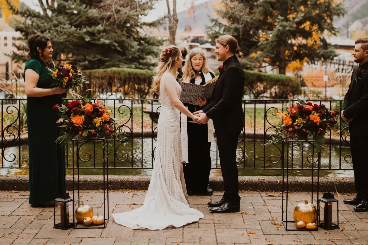 Courtyard fall wedding ceremony at Hotel Colorado in Glenwood Springs, Colorado