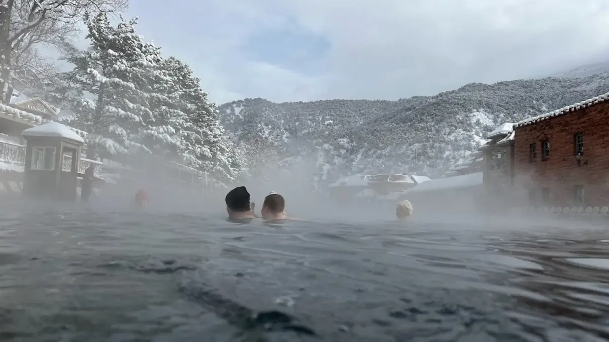 People enjoying Glenwood Hot Springs Pool in winter