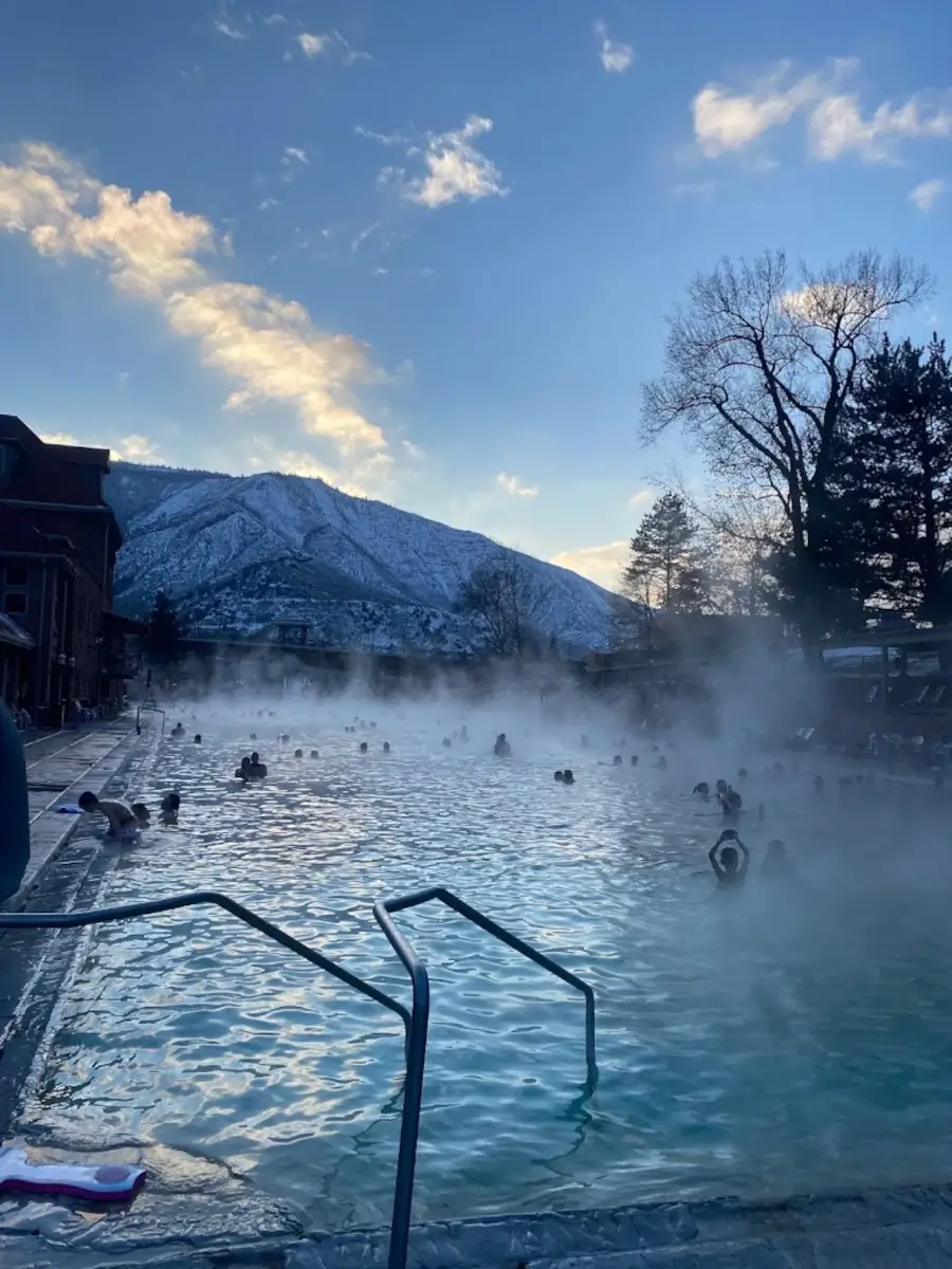 people soaking at Glenwood Hot Springs Pool in winter
